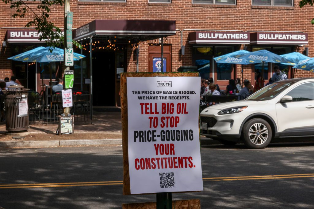 WASHINGTON, DC - MAY 03: A poster hung by supporters of Climate Power can be seen on Capitol Hill calling on Congress to stop big oil companies from price-gouging consumers on May 3, 2024 in Washington, D.C. (Photo by Jemal Countess/Getty Images for Climate Action)