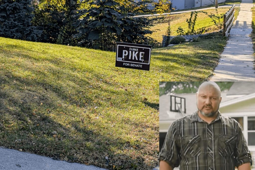 A screenshot of Mike Pike, a bald man in a green shirt, on top of an image of his yard sign in a grassy yard. The sign is black and reads: "I Like Pike" in white.