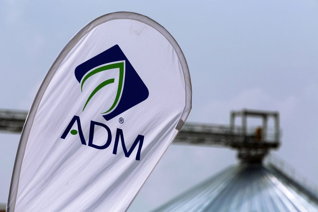 ADM logo in front of a grain silo.